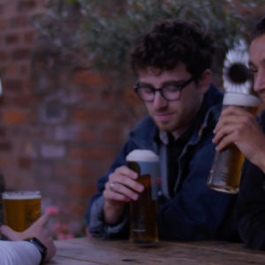 Lads have a pint at the pub
