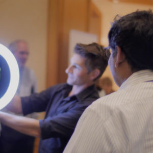 Man demonstrating a light product at Symphony AI event
